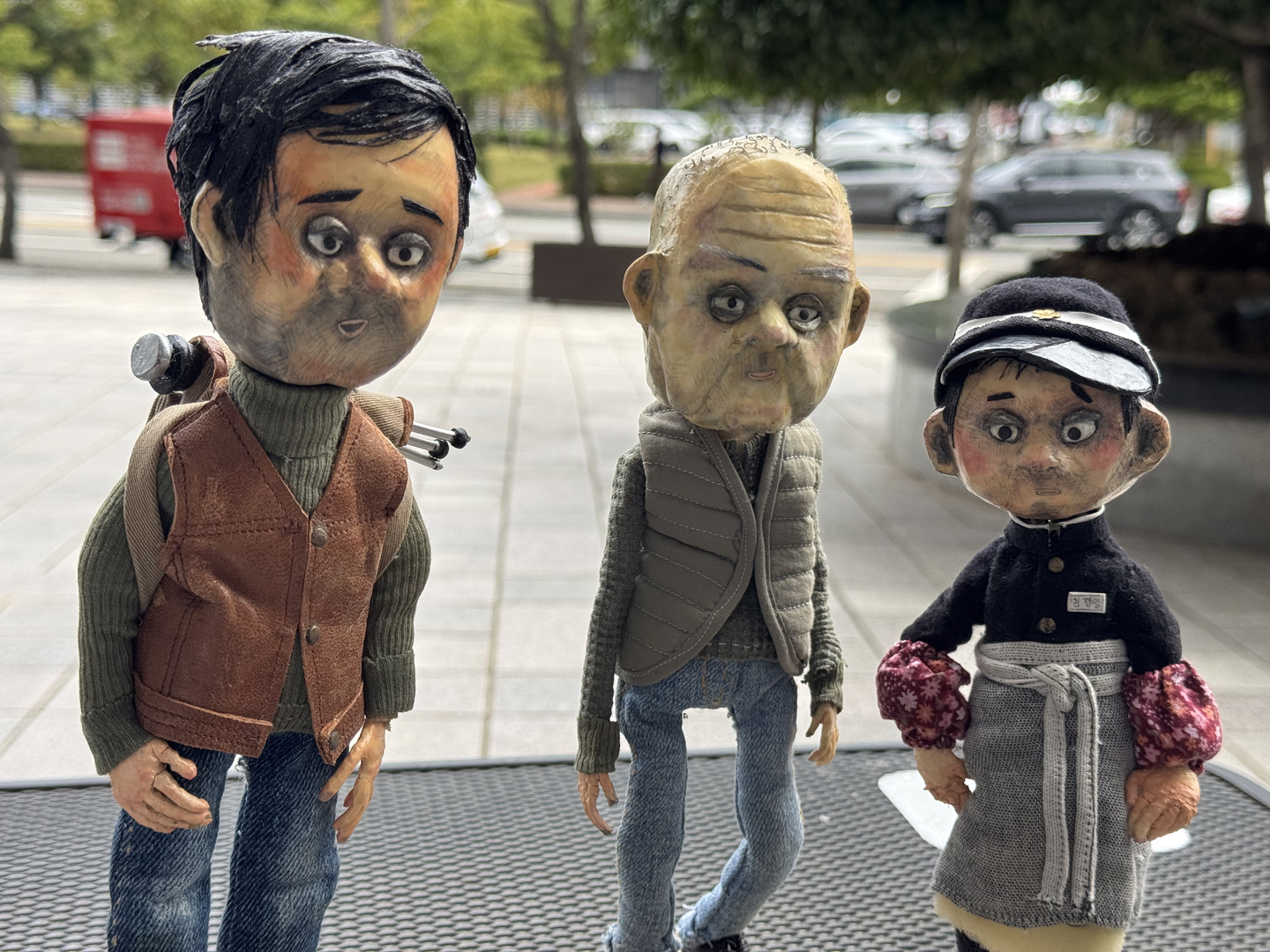 The puppets from director Yoo Lee's ″A Man Who Takes Pictures of Flowers,″ which depict the different ages of the film's protagonist, late photographer Kim Jung-myung [KIM JI-YE]