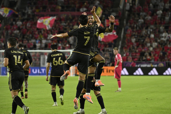LAFC forward Son Heung-Min celebrates with LAFC forward Denis Bouanga after scoring a goal against St. Louis City in the first half at Energizer Park in St. Louis on Sept. 27. [REUTERS/YONHAP]