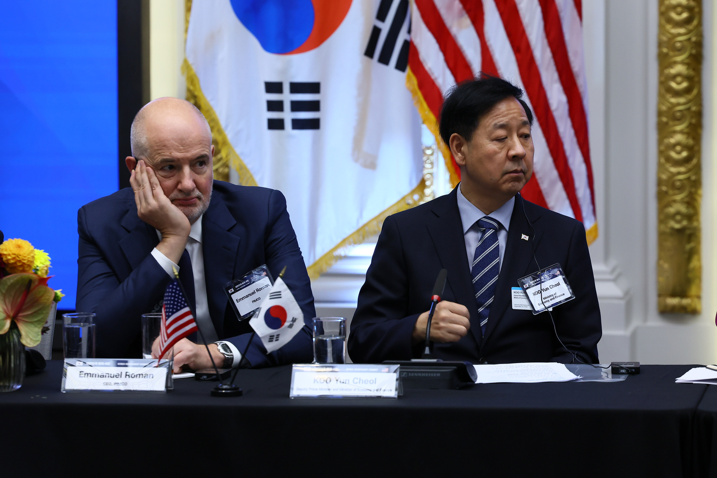 Koo Yun-cheol, minister of economy and finance, right, and Emmanuel Roman, CEO of Pimco, listen to President Lee Jae Myung’s remarks during the Korea Investment Summit at the New York Stock Exchange on Sept. 25. [JOINT PRESS CORPS]