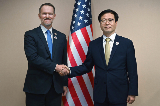 This photo, released by Korea's Industry Ministry, shows Trade Minister Yeo Han-koo, right, shaking hands with U.S. Trade Representative Jamieson Greer in Malaysia as the two meet to attend a meeting of economic ministers of the Association of Southeast Asian Nations (Asean). [MINISTRY OF TRADE, INDUSTRY AND ENERGY]