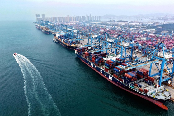 This aerial view shows container ships berthed at a port in Qingdao, in eastern China's Shandong province, on Sept. 24. [AFP/YONHAP]