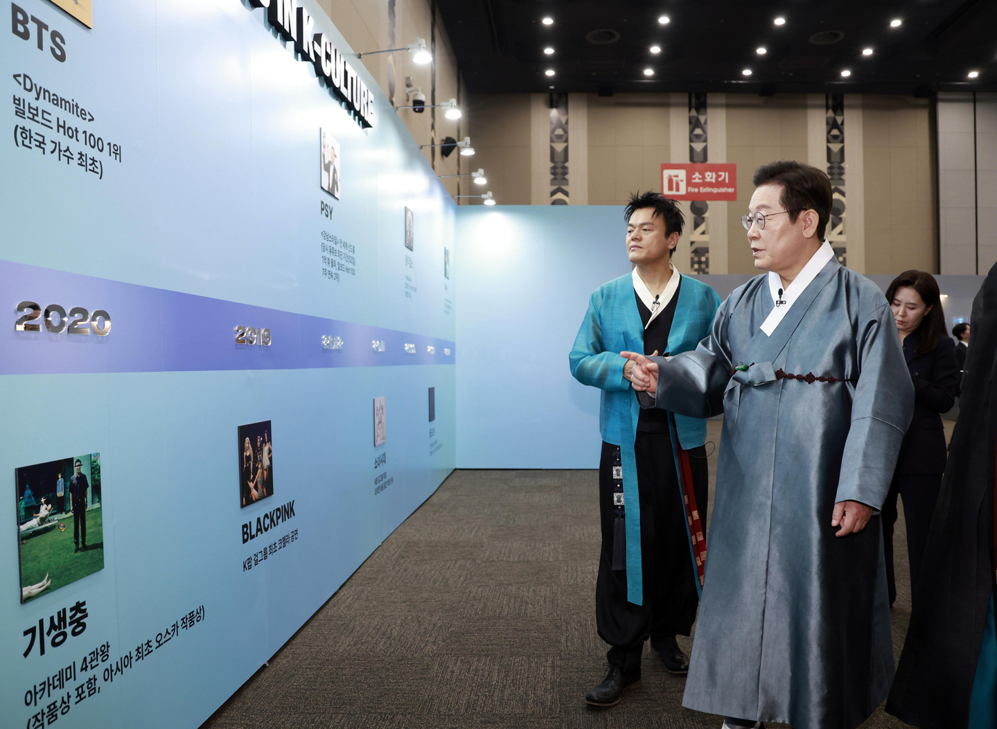 President Lee Jae Myung, right, and JYP Entertainment founder and Co-Chair of the newly established Presidential Committee on Popular Culture Exchange Park Jin-young, left, look aroud the K-culture exhibition zone inside Kintex in Goyang, Gyeonggi, on Oct. 1. [JOINT PRESS CORPS]