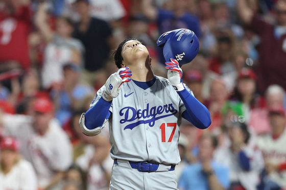 Shohei Ohtani of the Los Angeles Dodgers reacts after striking out in the third inning against the Philadelphia Phillies in game one of the Division Series at Citizens Bank Park on Oct. 4, in Philadelphia. [AFP/YONHAP]