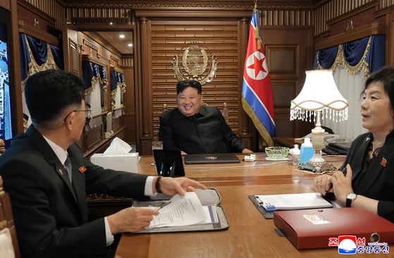 A photo released by the official North Korean Central News Agency shows North Korean leader Kim Jong-un, center, on his private train in Pyongyang on Sept. 1. [EPA/YONHAP] 