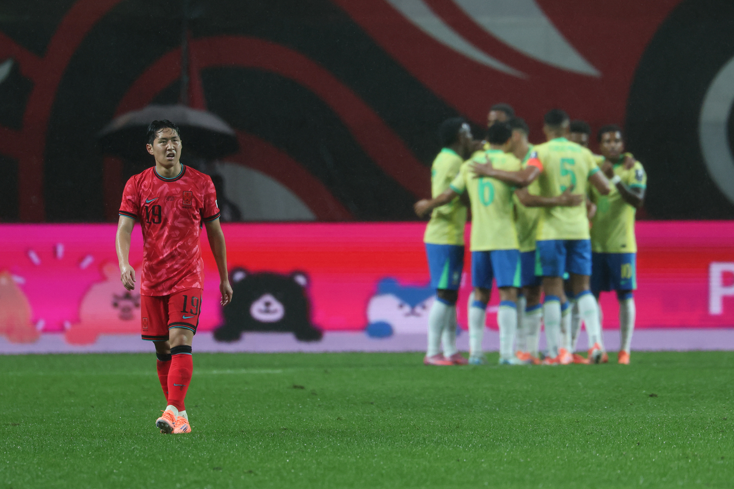 Korea's Lee Kang-in, left, reacts during a friendly against Brazil at Seoul World Cup Stadium in western Seoul on Oct. 10. [KFA] 