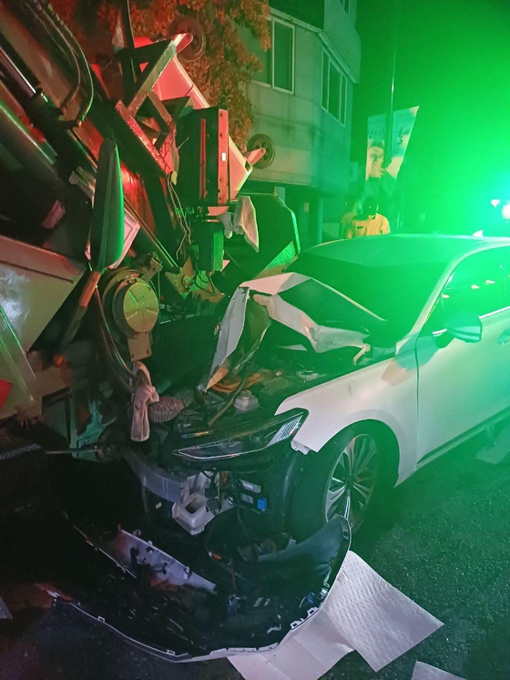 The scene of a car accident where a street cleaner was hit and killed by a drunk driver in Cheonan, South Chungcheong, on Aug. 7, 2024 [CHEONAN DONGNAM FIRE STATION]