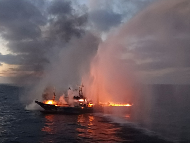 A 129-ton fishing boat registered in Busan burns about 35 kilometers (22 miles) southeast of Marado on Oct. 12. [JEJU COAST GUARD]