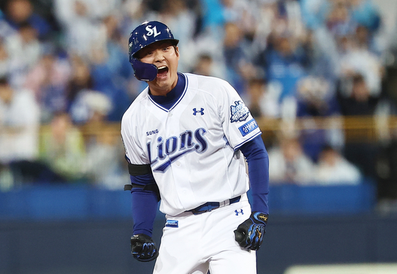 Koo Ja-wook of the Samsung Lions celebrates after hitting an RBI double against the SSG Landers during Game 3 of the first-round series in the KBO postseason at Daegu Samsung Lions Park in the southeastern city of Daegu on Oct. 13. [YONHAP]