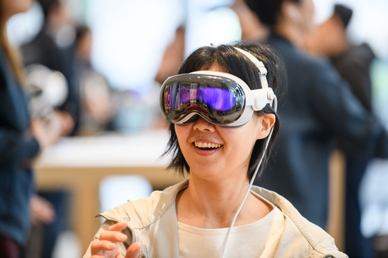 A customer is seen experiencing Apple's Vision Pro released in Korea at the Apple Myeongdong store in Jung District, central Seoul on Nov. 15, 2024. [APPLE]