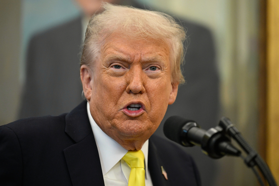 President Donald Trump speaks during an event in the Oval Office at the White House on Oct. 15, in Washington. [AP/YONHAP]