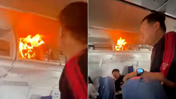 A lithium battery catches fire inside an Air China airplane that departed from the Hangzhou Xiaoshan International Airport on Oct. 18, forcing the pilot to make an emergency landing in Shanghai instead of Incheon, the initial destination. [SCREEN CAPTURE]