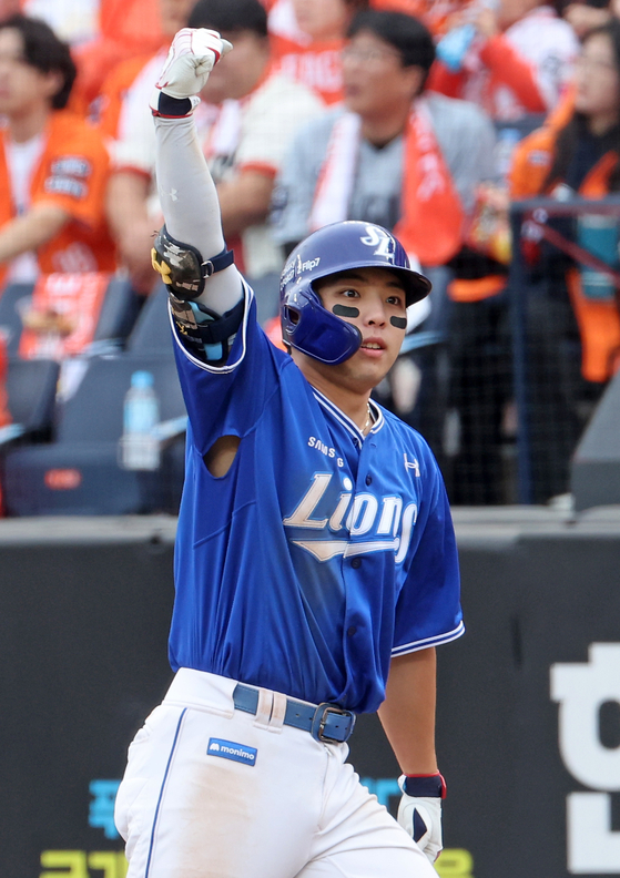 Kim Young-woong of the Samsung Lions celebrates after hitting a two-run single against the Hanwha Eagles during Game 2 of the second-round series in the KBO postseason at Daejeon Hanwha Life Ballpark in the central city of Daejeon on Oct. 19, 2025. [YONHAP]