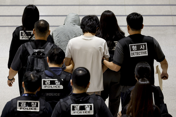 Korean nationals who had been detained by Cambodian police are repatriated and arrive at Incheon International Airport on Oct. 18. [JOINT PRESS CORPS]