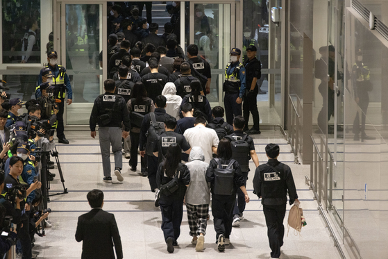 Korean nationals who had been detained by Cambodian police are repatriated and arrive at Incheon International Airport on Oct. 18. [JOINT PRESS CORPS]