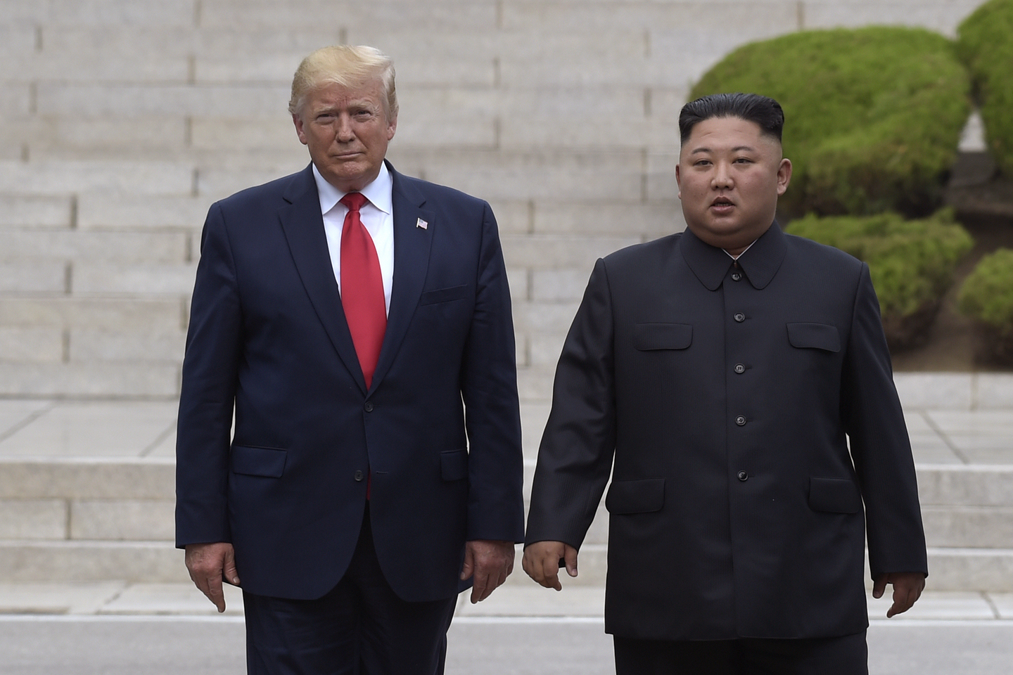 U.S. President Donald Trump, left, meets with North Korean leader Kim Jong-un at the North Korean side of the border at the village of Panmunjom in the demilitarized zone on June 30, 2019. [AP/YONHAP]