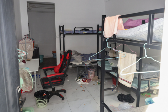 Clothes and other personal belongings are seen inside Taiza Complex, a criminal enclave near Phnom Penh, Cambodia, on Oct. 16. [YONHAP]