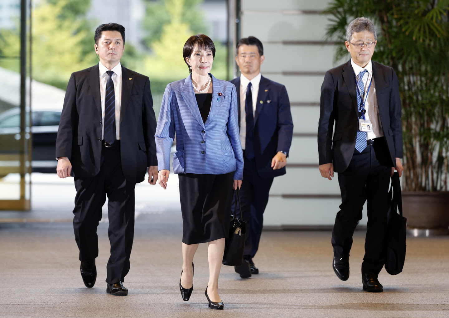Newly elected Japanese Prime Minister Sanae Takaichi, second from left, arrives at the prime minister's office in Tokyo on Oct. 21. [EPA/YONHAP]