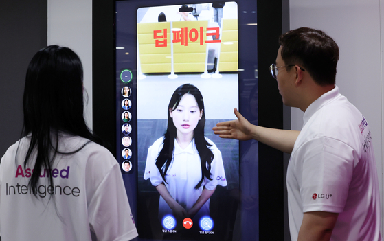 Models demonstrate LG U+’s AI “Anti-Deepfake” technology during a security tech briefing at the LG Seoul Station Building in central Seoul on June 26. [NEWS1] 