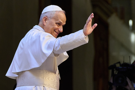 Pope Leo XIV waves upon his arrival at the St. Augustin Basilica to address his fellow Augustinians at the start of their global assembly in Rome on Sept. 1. [AP/YONHAP]