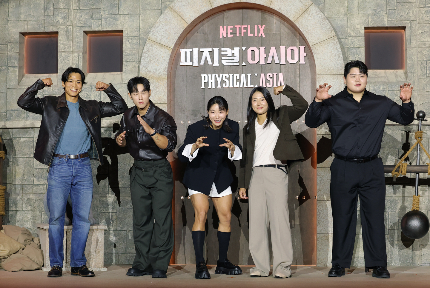 The Korean team members of Netflix’s “Physical: Asia” pose for photos during the show’s press conference held in southern Seoul on Oct. 24. From left are “Physical: 100” season 2 winner Amotti, Olympic skeleton gold medalist Yun Sung-bin, wrestling player Jang Eun-sil, crossfit athlete Choi Seung-yeon and ssireum (Korean wrestling) champion Kim Min-jae. [NEWS1]