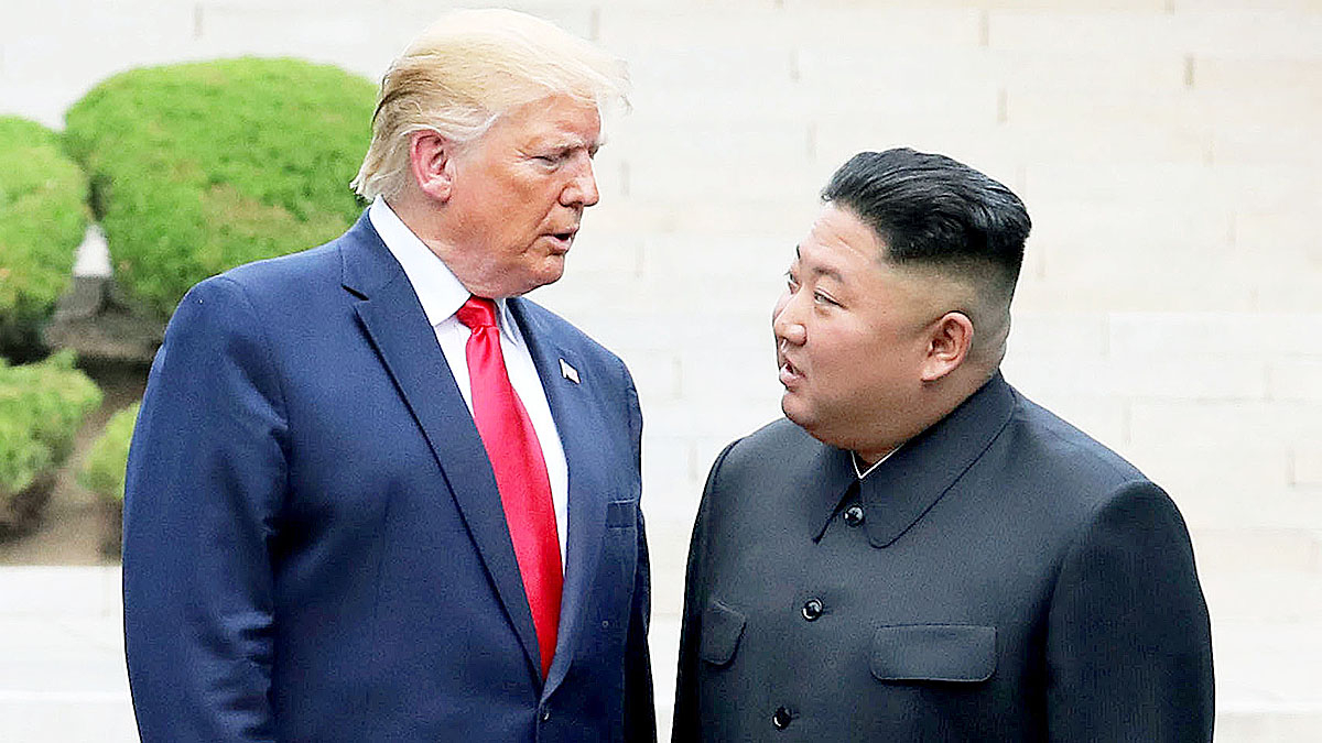 Donald Trump, left, and Kim Jong-un are seen together on the North Korean side of Panmunjom, the truce village in the demilitarized zone, in June 2019. [YONHAP] 