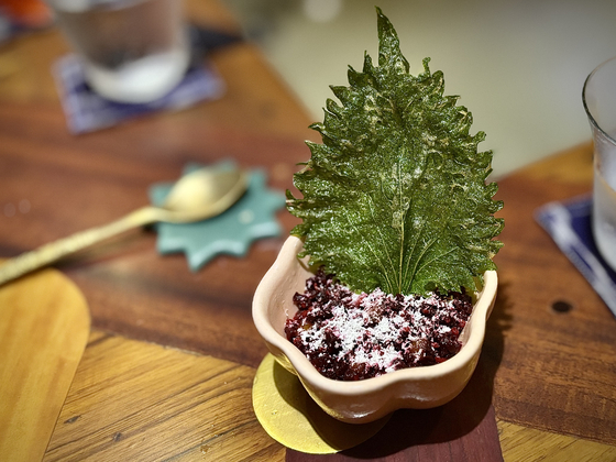 Curried rice, a comfort dish in southern India, is reimagined with beetroot, Spanish goat cheese and a side of crunchy shiso tempura at Papa's, a fine dining restaurant in Mumbai [LEE JIAN]