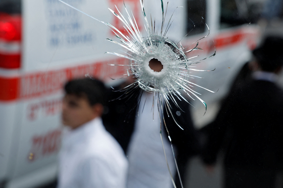 A bullet hole on a bus is seen at the scene where a suspected shooting attack took place at the outskirts of Jerusalem on Sept. 8. [REUTERS/YONHAP] 