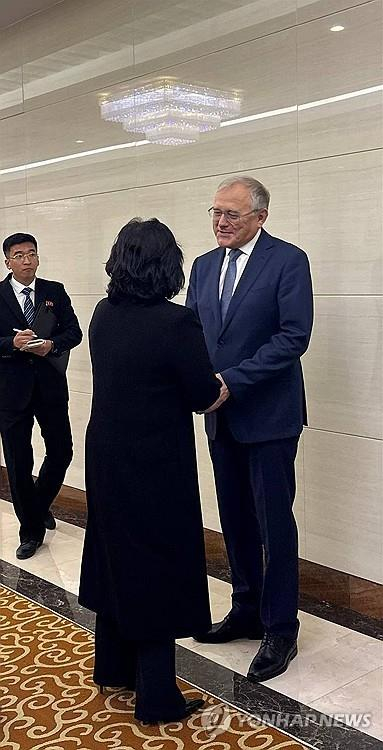 Russian Ambassador to North Korea Alexandr Matsegora, right, holds hands with North Korean Foreign Minister Choe Son-hui at Pyongyang International Airport ahead of her overseas trip, in this photo captured from the embassy's Telegram account on Oct. 26. [SCREEN CAPTURE]