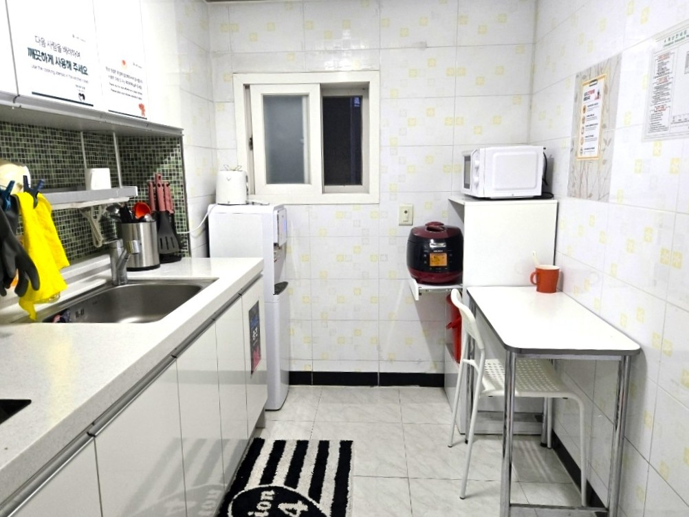 A shared kitchen at Ines Bengochea's gosiwon (small, affordable single-room housing) [INES BENGOCHEA]