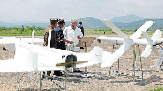 North Korean leader Kim Jong-un supervises performance tests of various unmanned aerial vehicles organized by the Unmanned Aerial Vehicle Research Institute of the State Academy of Defense Sciences on Oct. 26. [NEWS1]