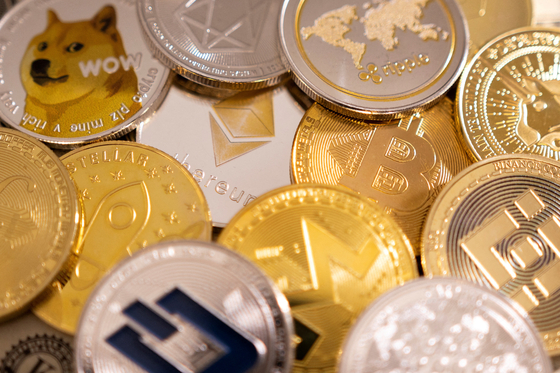 A representation of cryptocurrencies is seen in this illustration taken on Jan. 24, 2022. [REUTERS/YONHAP]