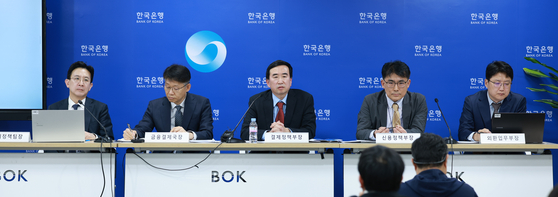 Bank of Korea officials speak during a press briefing on key issues and policy responses related to a potential won-based stablecoin at the central bank's headquarters in Jung District, central Seoul, on Oct. 27. [BANK OF KOREA]