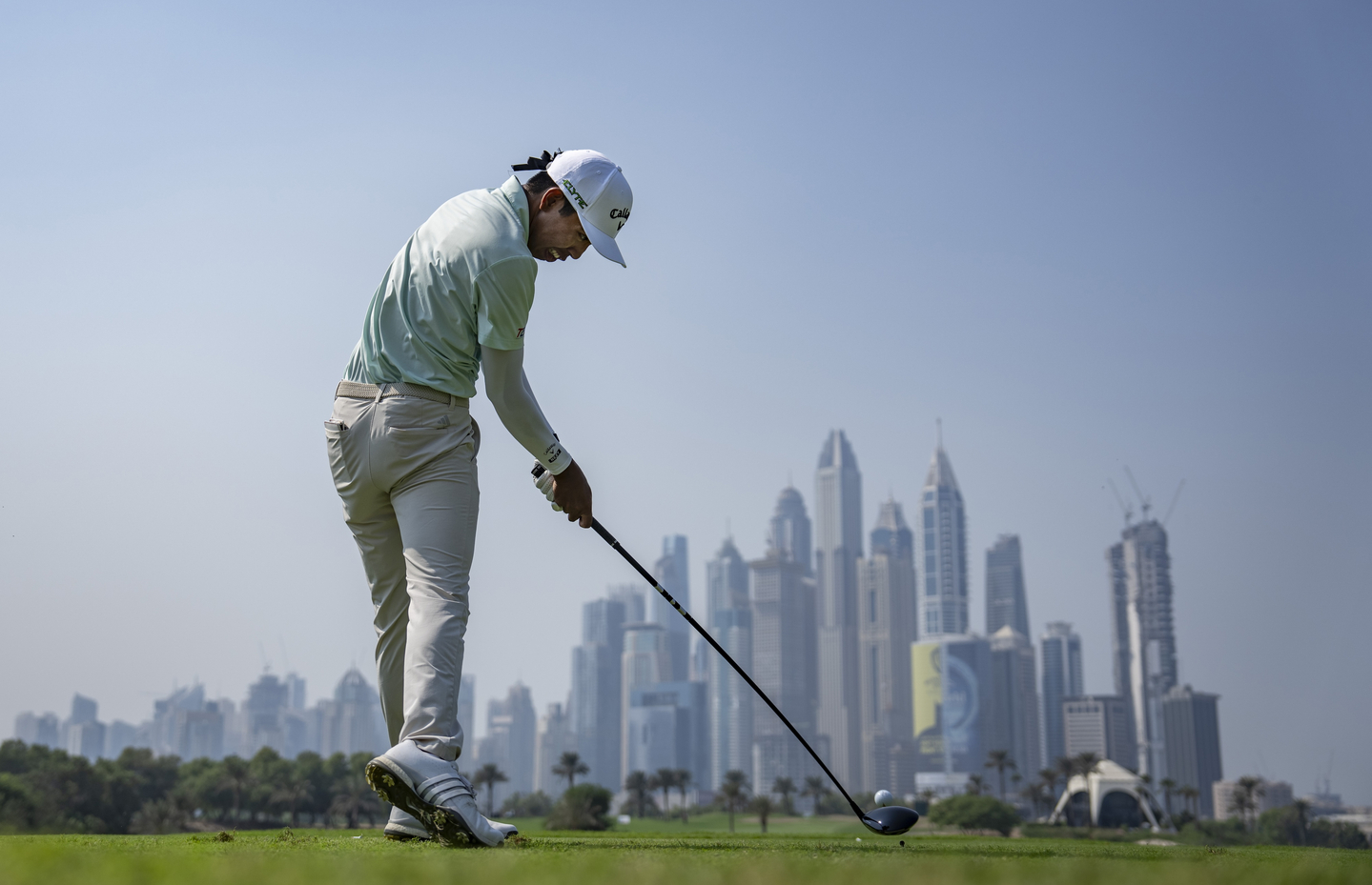 Fifa Laopakdee of Thailand plays his stroke from the No. 8 tee during the final round of the 2025 Asia-Pacific Amateur Championship at the Emirates Golf Club Majlis Course in Dubai, United Arab Emirates on Oct. 26.  [AAC]