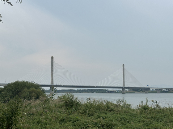 The Daedong Hwamyeong Bridge, connecting Busan and Gimhae, pictured on Oct. 2, marks the entrance to Busan proper and the final stretch of the cross-country route. [JIM BULLEY]