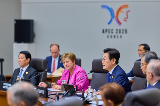 Korean President Lee Jae Myung, right, speaks during the first session of the APEC Economic Leaders' Meeting at the Gyeongju Hwabaek International Convention Center in Gyeongju, North Gyeongsang on Oct. 31. [JOINT PRESS CORPS]