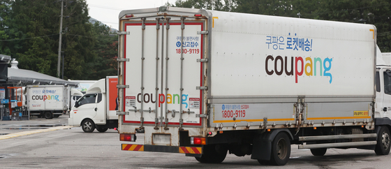The Coupang logo is seen on a delivery truck at the company's logistics center in Seoul on Aug. 6. [YONHAP] 