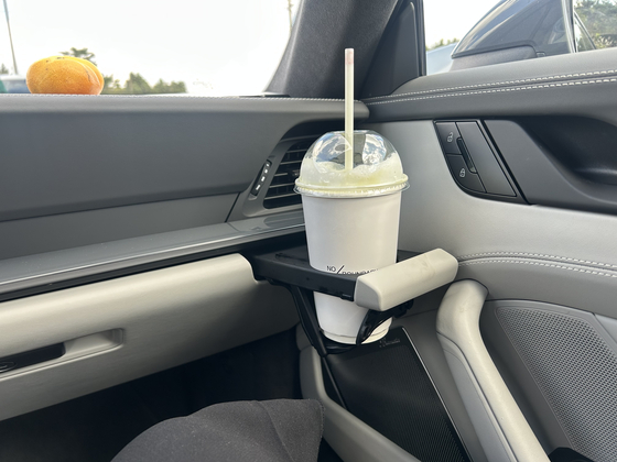 A cup holder pops out of the dashboard in Porsche's 911 Carrera 4 GTS [PORSCHE KOREA]