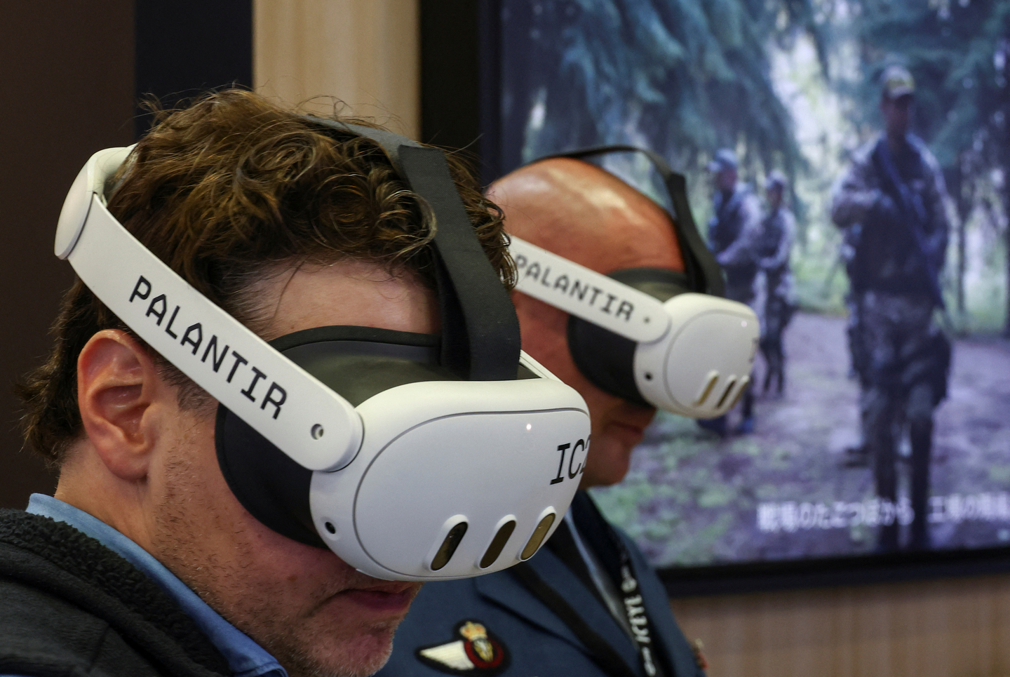 People try the Palantir Maven Smart System during the Defence Security Equipment International Japan at Makuhari Messe in Chiba, east of Tokyo, on May 21. [REUTERS/YONHAP]