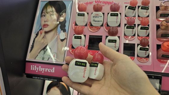 Miniature cosmetic products on display at an Olive Young store in Jongno 1-ga, central Seoul [NOH YU-RIM]