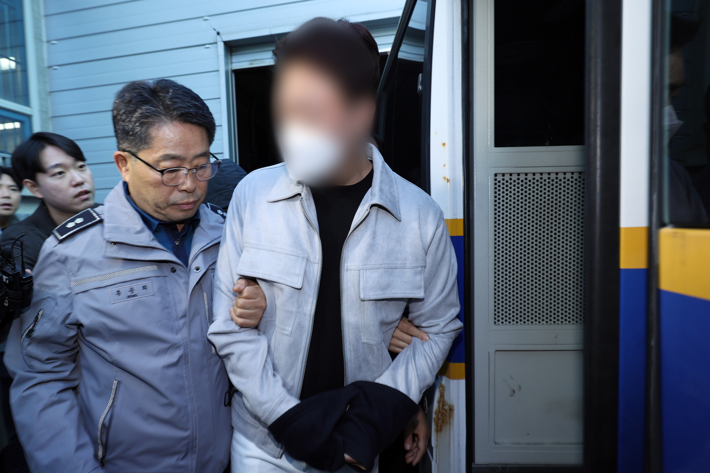 The driver, surnamed Kim, of the Maserati involved in a fatal hit-and-run is transferred to prosecutors from the Gwangju Seo Police Precinct in Seo District, Gwangju, on Oct. 4, 2024. [YONHAP]