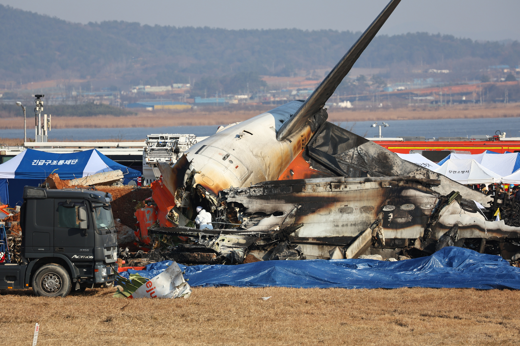 A Jeju Air aircraft is seen being destroyed after hitting a perimeter fence at Muan International Airport in South Jeolla on Dec. 29. [YONHAP]