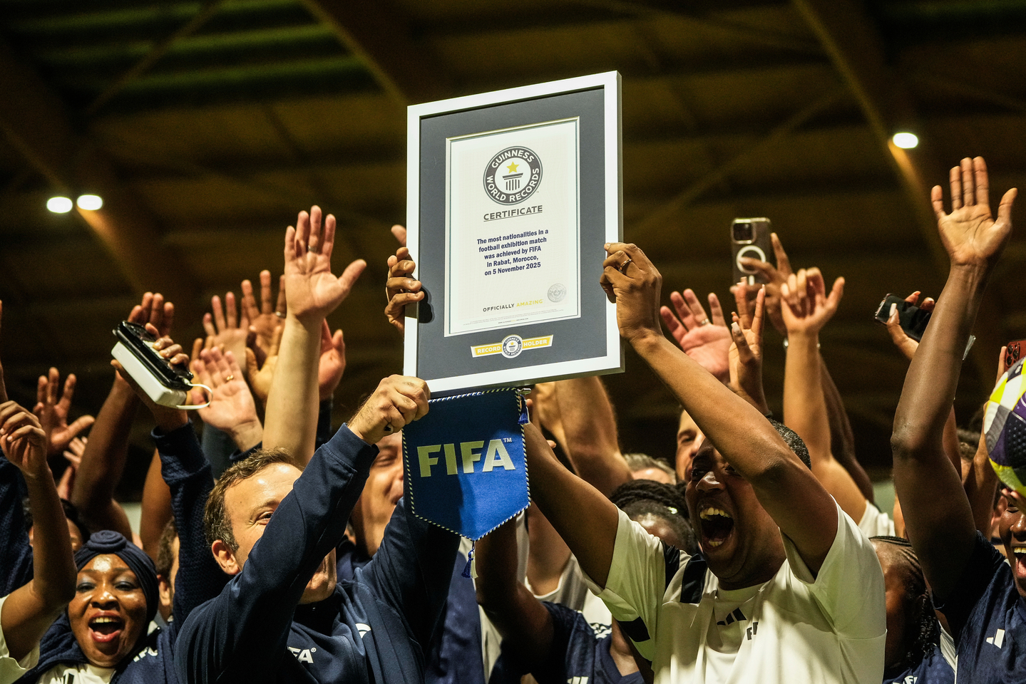 People celebrate after breaking the Guinness World Record for most nationalities in an exhibition soccer match organized by FIFA, in Rabat, Morocco, Wednesday, Nov. 5, 2025. [AP/YONHAP]
