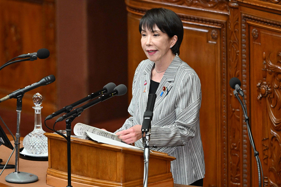 Japanese Prime Minister Sanae Takaichi answers questions from Yoshihiko Noda, the leader of the main opposition Constitutional Democratic Party of Japan, regarding her policy speech at the House of Representatives of the National Diet in Tokyo on Nov. 4.