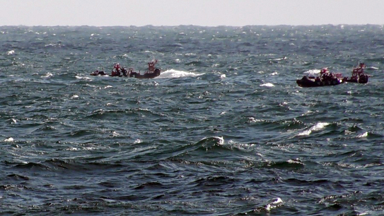 Officials search for nine missing crew members from a capsized Chinese fishing boat near Eocheong Island in Gunsan, North Jeolla, on Nov. 10. [GUNSAN COAST GUARD]