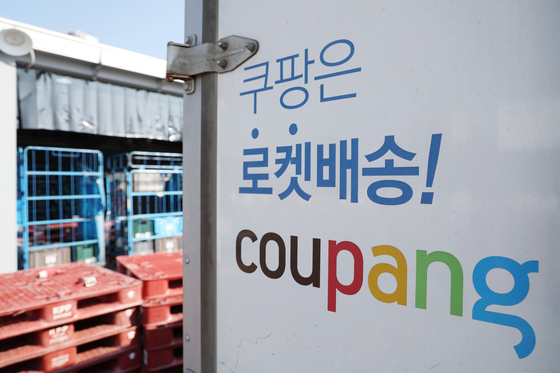 The Coupang logo is seen on a delivery truck at the firm's logistics center in Seoul on Nov. 5. [YONHAP] 