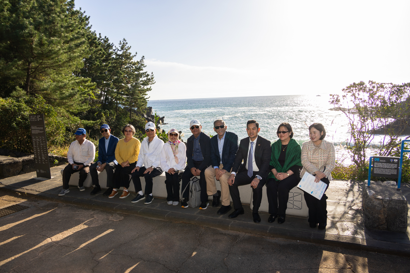 Asean diplomats take a seat at the ASEAN-Korean Olle Commemorative Bench at the ASEAN-Korea Olle in Seogwipo, Jeju Island, on Nov. 11. [ASEAN-KOREA CENTRE]