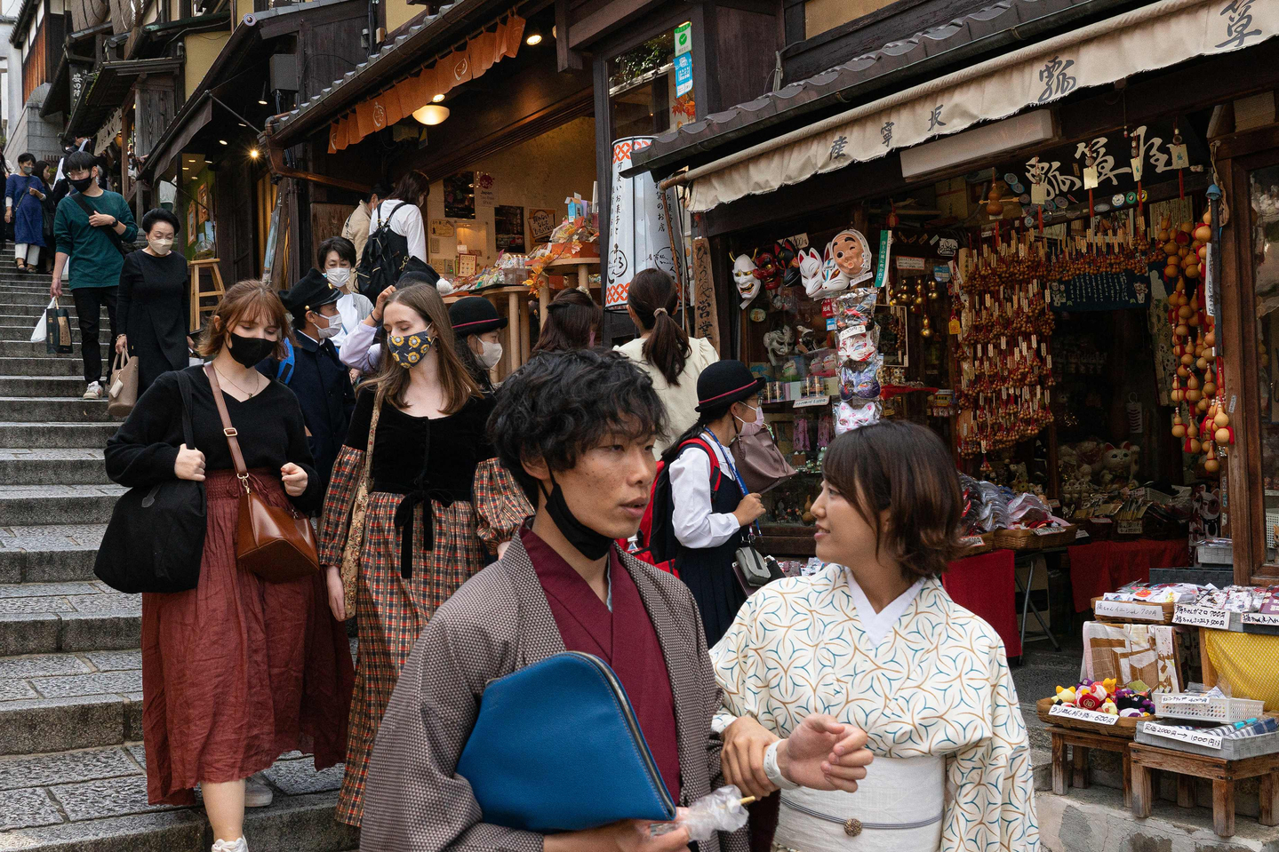 People walk down a shopping street in a touristy section of Kyoto on October 11, 2022. [AFP/ YONHAP]