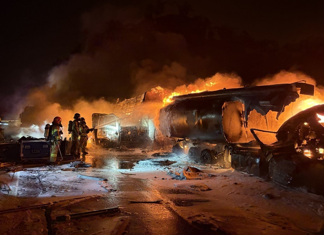 Firefighters work to extinguish the fire that broke out after a multi-vehicle collision involving a fuel tanker, several cargo trucks and passenger vehicles on the Sangju-Yeongcheon Expressway on Nov. 17. [GYEONGSANGBUK-DO FIRE DEPARTMENT]