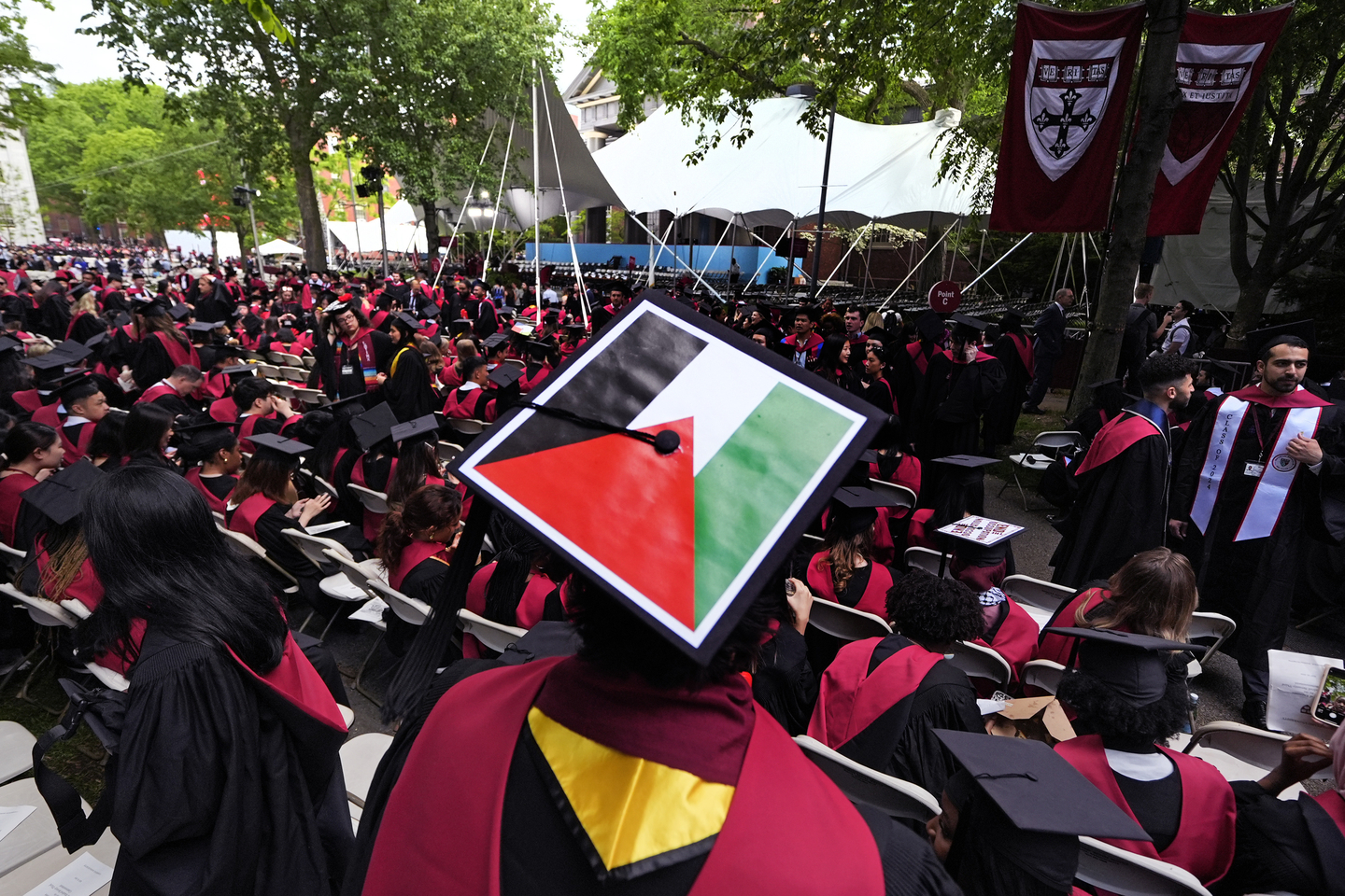 A student displays the Palestinian flag on his mortar board as graduates take their seats in Harvard Yard during commencement at Harvard University, Thursday, May 23, 2024, in Cambridge, Mass. [AP/YONHAP]
