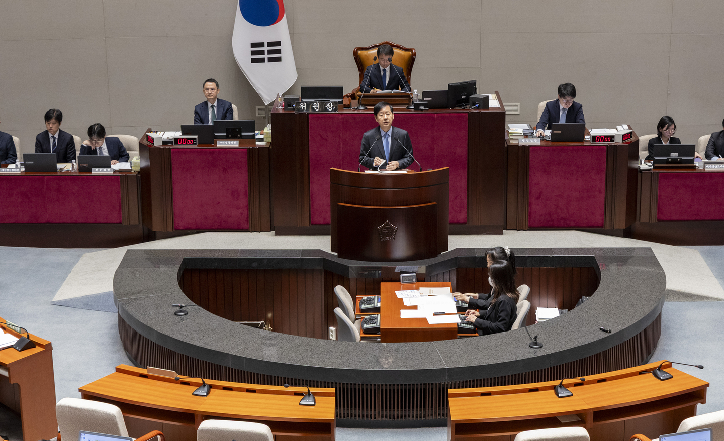 Deputy Prime Minister and Finance Minister Koo Yun-cheol explains the government’s budget proposal during a plenary session of the National Assembly’s Special Committee on Budget and Accounts on Nov. 6. The committee began its full review of the government’s 2026 budget plan that day. [YONHAP]